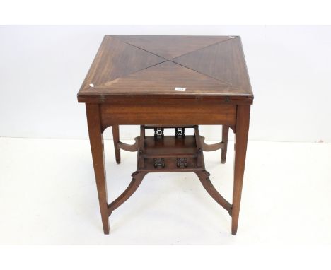 Early 20th century Mahogany Envelope Card Table with red baise playing surface, 66cms wide x 71cms high 