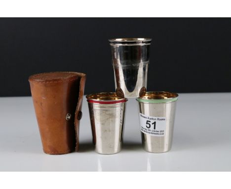 Set of Three Stacking Stirrup Cups with Enamel Rims and Gilt Lined Interiors contained in a Real Hide Leather Case 