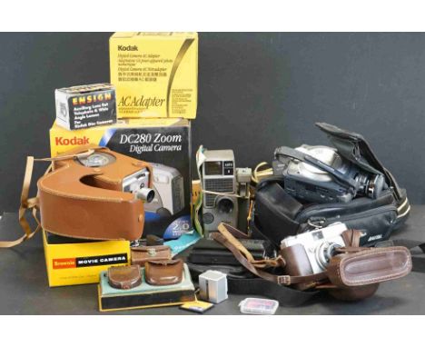 A collection of photographic equipment to include light meters, film splicer, video camera..etc. 