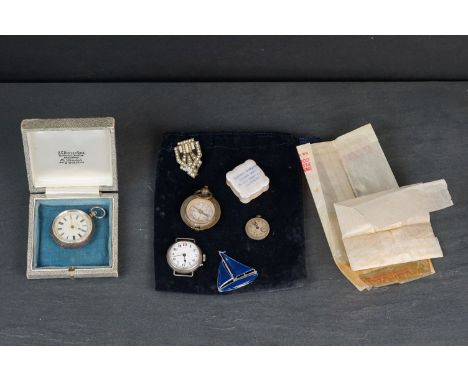 A vintage silver cased fob watch together with a trench watch, compass and brooches. 