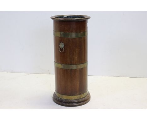 Early 20th century Mahogany and Brass Bound Circular Stick Stand, with lion mask ringed handles, 65cms high 