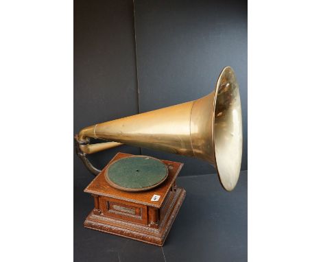 An early 20th century Gramophone by the The Gramophone &amp; Typewriter Company Limited, with oak cabinet and brass horn toge