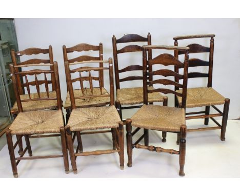 Three Pairs of Oak Ladder Back Chairs with Rush Seats together with one other similar chair 