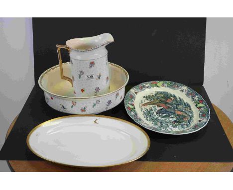An early 20th century wash jug and basin together with two serving platters. 