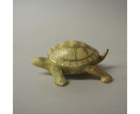 Royal Worcester porcelain blush ivory 'okimono' in the form of a tortoise, puce printed mark and date code for 1913, 2.5cm hi