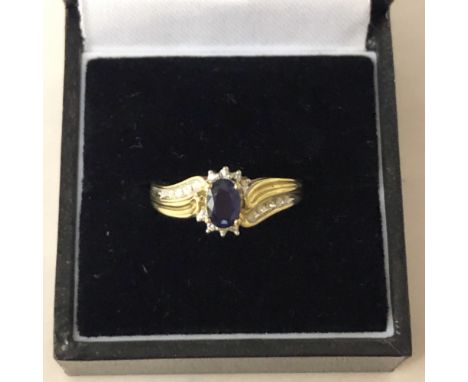 9ct gold mounted diamond and sapphire ring, central sapphire approx 0.3ct, ring size N/O