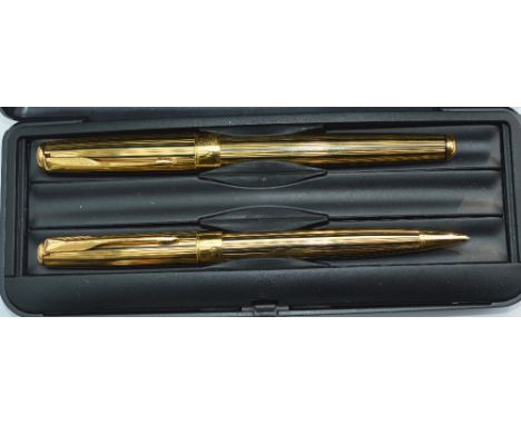 A Parker Sonnet roller ball and pencil set - gold/black stripe