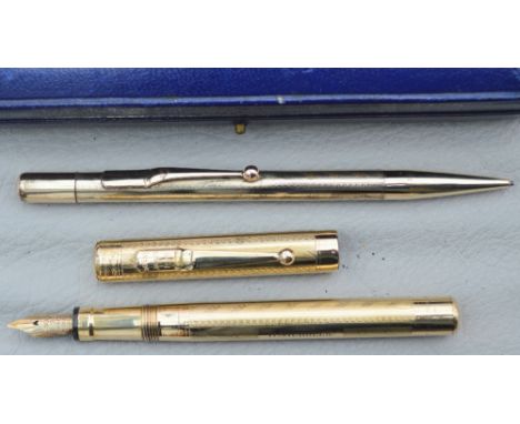A gold plated Swan Mabie Todd fountain pen and pencil - engraved R Nichols - boxed