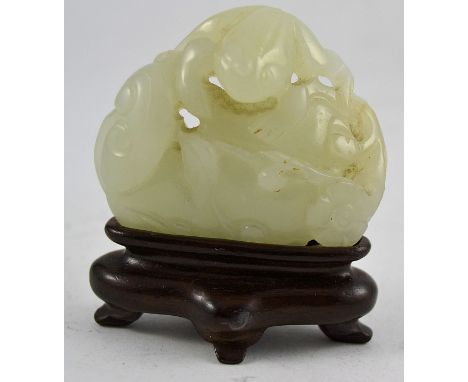 A stunning Chinese Jade carving of a frog set on a leaf and stone complete with a wooden plinth base. L5cm 