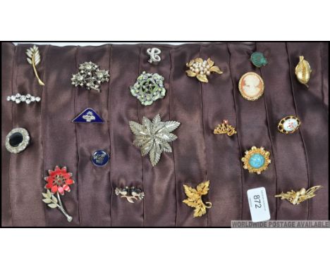 A pad of vintage and later costume jewellery brooches to include enamel examples