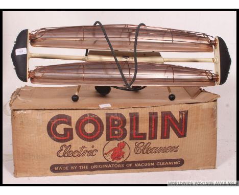 A vintage mid century Goblin hoover in the original box of atomic style together with a retro dimplex fire ( display only )