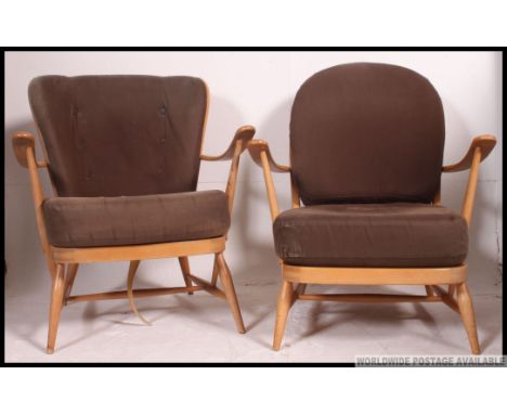 A pair of 1970's retro Ercol Golden Dawn  beech and elm Windsor pattern armchairs. Raised on stub turned legs with stretchers