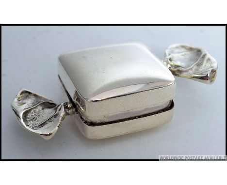 A white metal 925 silver pill / snuff box in the form of a wrapped sweet. Stamped 925.  L5cm 12g