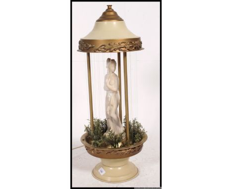 A retro Mineral Oil Motion Rain Lamp, having a ceramic figure to centre in a very good clean working condition