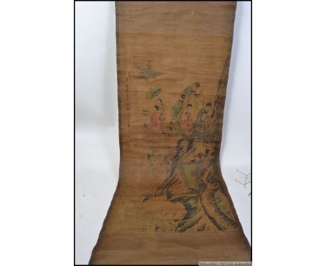 A 19th century Chinese hand painted scroll having family scenes with Chinese characters to the left of the scroll 