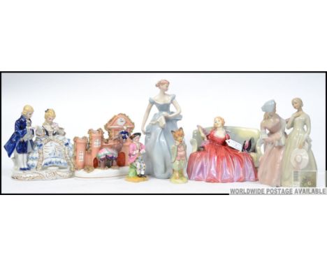 A 19th century Elephant flatback, two Royal Dux porcelain figures of young girls along with a Royal Doulton ' Sweet and Twent