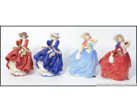 A group of 4 Royal Doulton figures to include Autumn Breeze HN1934 and Autumn Breeze HN3736 Michael Doulton light blue two to