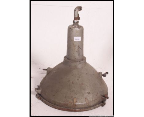 A vintage industrial factory light by Revo, retaining original paintwork and glass. H40 x W39cm 