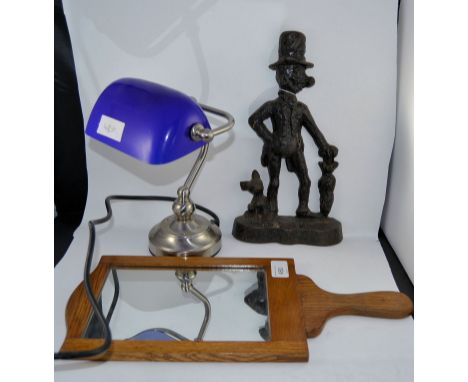 A mid century Opticians eye test paddle and mirror together with a cast iron doorstop and a bankers lamp