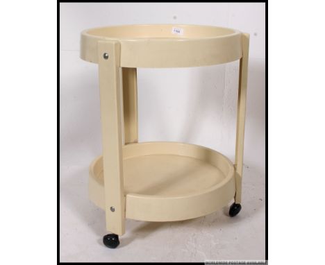 A 1970's Italian vintage two tier round plastic side table / trolley on original castors