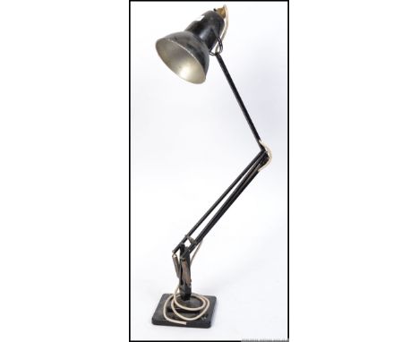 A pre-war black Industrial Herbert Terry anglepoise lamp raised on square terraced base with pendant shade