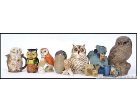 A collection of ceramic Owls to include examples Beswick, Poole, Caithness style etc