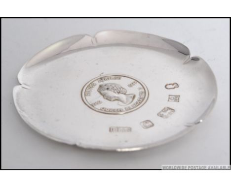 A silver hallmarked Tudor Rose style pin dish ( with original box ) to commemorate the Silver Jubilee of Queen Elizabeth II, 