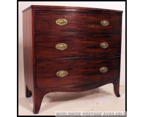 A 19th century Georgian mahogany bow front chest of drawers. The chest being raised on French kick legs with a straight set o