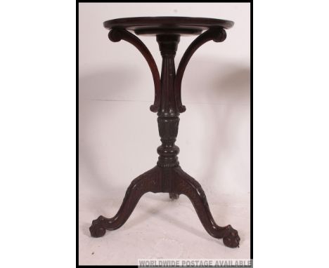 An early 20th century good quality tripod wine table. Raised on splayed leg base with turned column adorned and embellished w