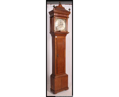 An 18th century eight day oak cased longcase / grandfather clock by John Thomas of Crewkerne. The twin-train movement strikin