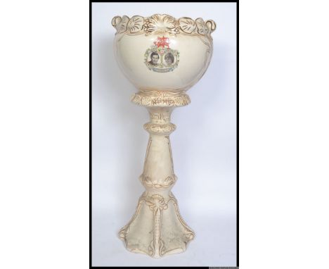 A vintage Charles & Diana planter on stand, the front embellished with Charles & Diana photographs and commemorative text. 90