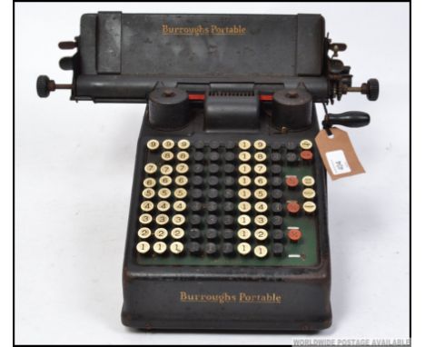 A vintage industrial Air Ministry desktop Burroughs Portable adding calculator machine, having applied air ministry plaque c1