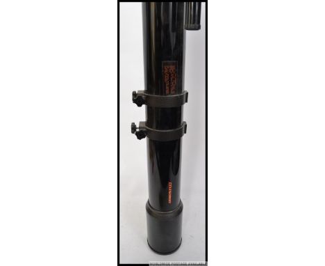 A 20th century Celestron telescope together with another telescope 20x30x40x 30mm on tripod