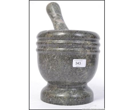 A large vintage 20th century pestle and mortar. H22cm 