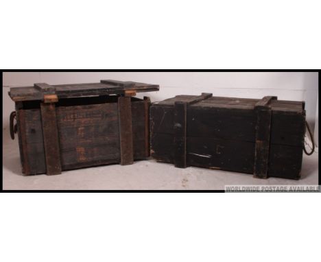 2 20th century military wooden transport / ammunition storage trunks of wooden construction, one grey, one black with rope ha