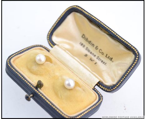 A pair of vintage 9ct gold pearl stud gentlemans shirt buttons complete in the original presentation box.