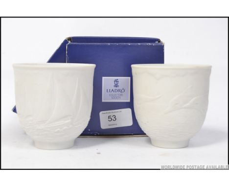 2 Lladro collectors editions white porcelain cups, one being complete in the original box