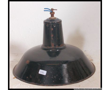 A mid century Industrial metal enamel painted black pendant factory light shade.
