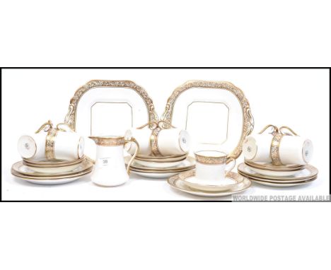 An extensive ten person bone china  tea service by Salisbury China  having a decorative gilt borders consisting of cups, sauc