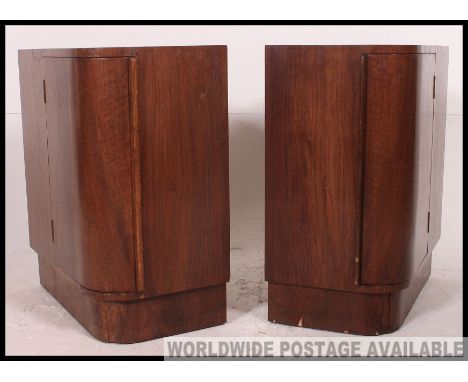 A pair of 1930's Art Deco mahogany bedside cabinets with bow front locker cabinet doors and shelves. H62 x W53 X D30cm