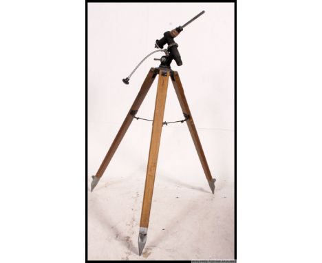 A mid century Industrial wooden tripod stand with original fixings atop - ideal as a conversion to a lamp
