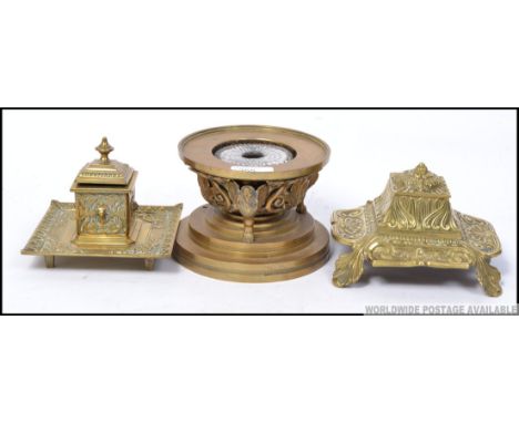 A good antique regency brass inkwell mounted with caryatids, along with two other brass inkwells. H10cm 