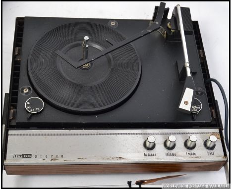 A vintage retro ITT KB Stereo record player, with detachable speakers acting as the lid. 