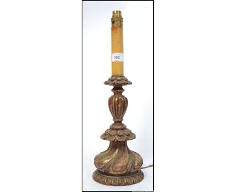 A stunning 20th century carved gilt wood table lamp