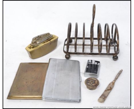 A silverplate toast rack of large form with markings for Pleasance & Harper. Together with a silver plate cigarette case, an 