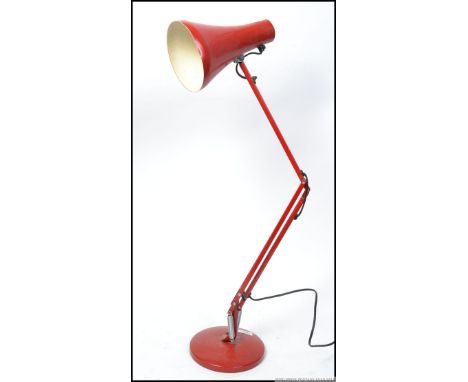 A retro style anglepoise lamp in red in the manner of Herbert Terry with pendant shade