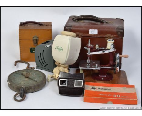 A dealers lot to include View master, vintage cased desk top sewing machine, a vintage ceramic Dutch wall mounted coffee grin
