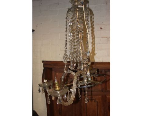 A vintage 20th century electric chandelier, having tear drop glass droplets ( A/F ) along with several spare glass droplets