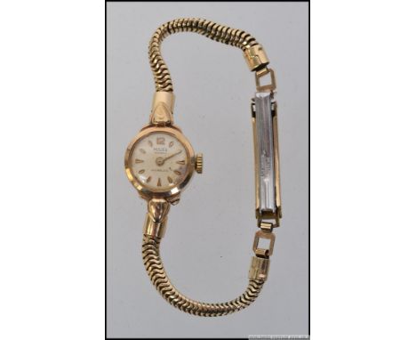A ladies 9ct / 375 gold vintage Majex 21 jewel  Incabloc cocktail dress watch set on snake style bracelet. Total weight 12g