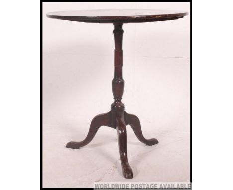 A late 18th century Georgian mahogany circular tilt top occasional table. Raised on splayed tripod leg vbase, turned column a